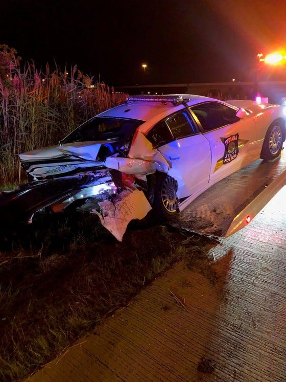 Trooper Riley Hieb had parked his Dodge Charger on the inside shoulder at that location with its emergency lights fully activated, and got out of his vehicle to investigate the crash scene. That is when state police said a woman driving a Chrysler 300, slammed into the police car at a high rate of speed, sending it across the lanes and into the grass.