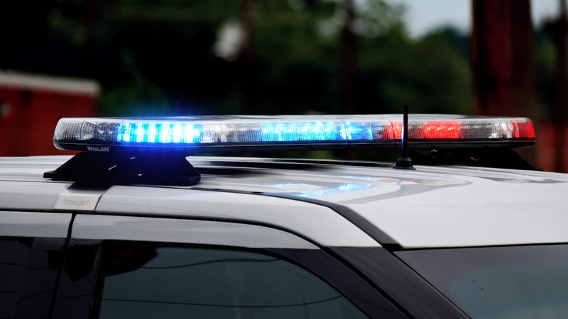 Police car flashing lights close up. Top of police car with flashing lights in daytime. Blue and red lights. Police at crime or accident scene.