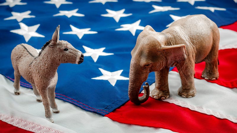 Democrats vs republicans are facing off in a ideological duel on the American flag. In American politics US parties are represented by either the democrat donkey or republican elephant