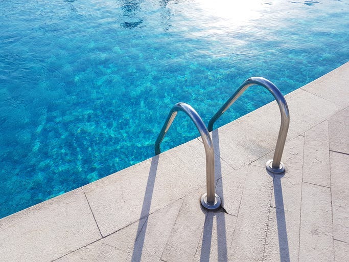 Ladder Entrance to a Pool - Getty Images