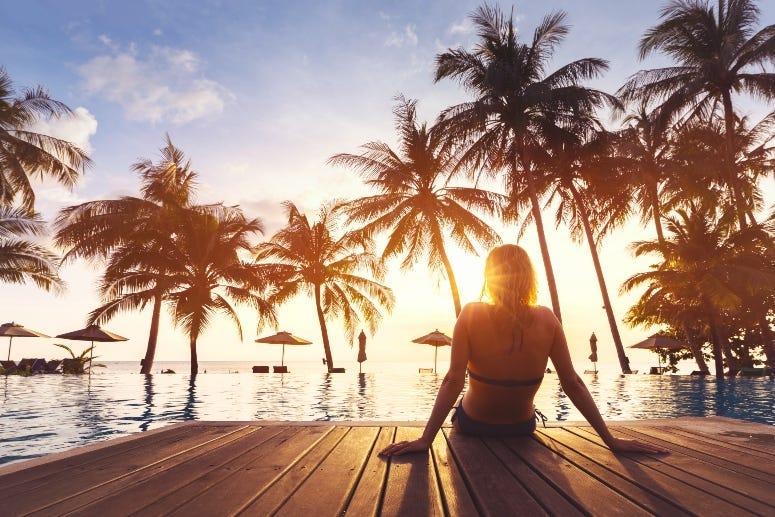 hotel pool with palm trees