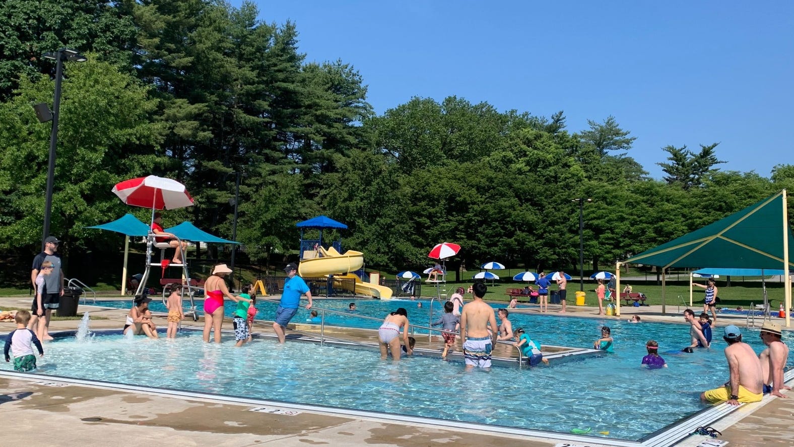 Poolgoers happy to beat the heat outside for first time in over a year as temperatures soar