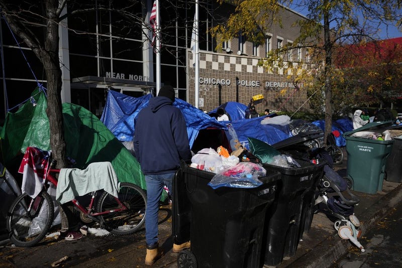 migrants at Chicago police station