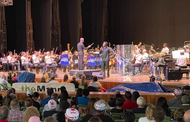 The Philly Pops perform on the Mann Center stage with Joshua Henry (center).
