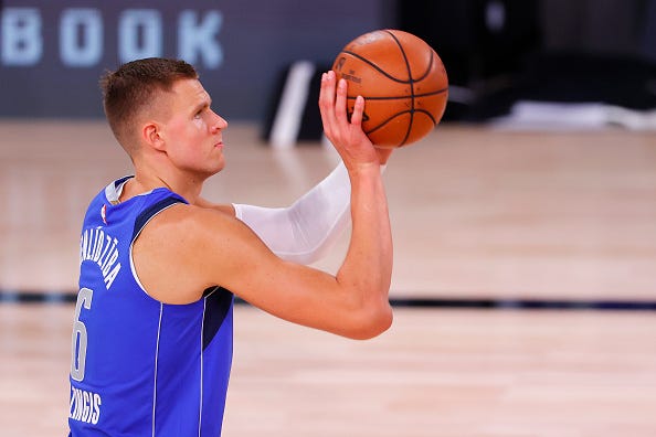 Kristaps Porzingis shoots a free throw for the Mavs. 