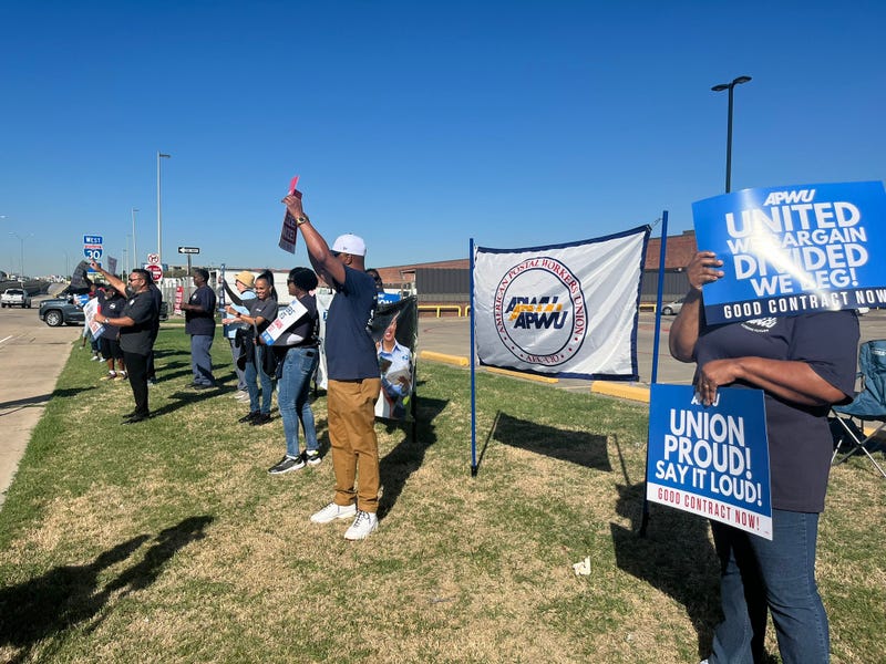Postal workers picket in Dallas, Texas on Tuesday, Oct. 1, 2024.