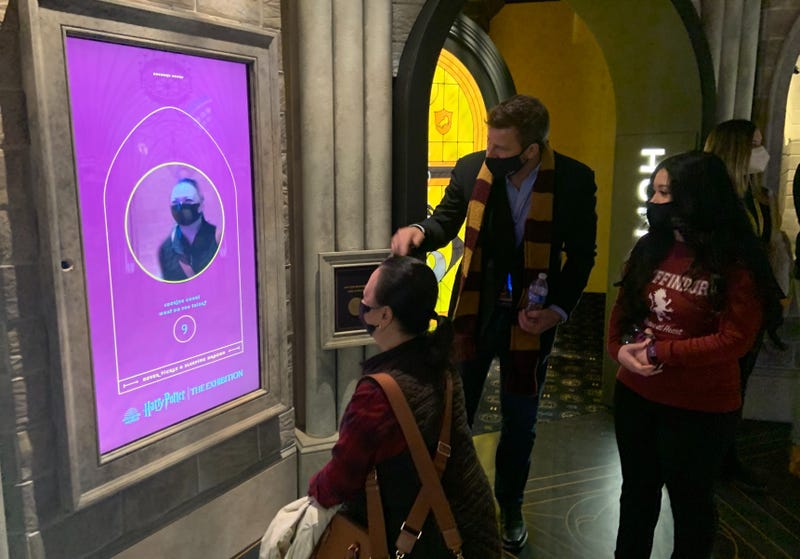 Visitors to the Franklin Institute's "Harry Potter: The Exhibition" create a profile at a kiosk before embarking on a tour through the Wizarding World.