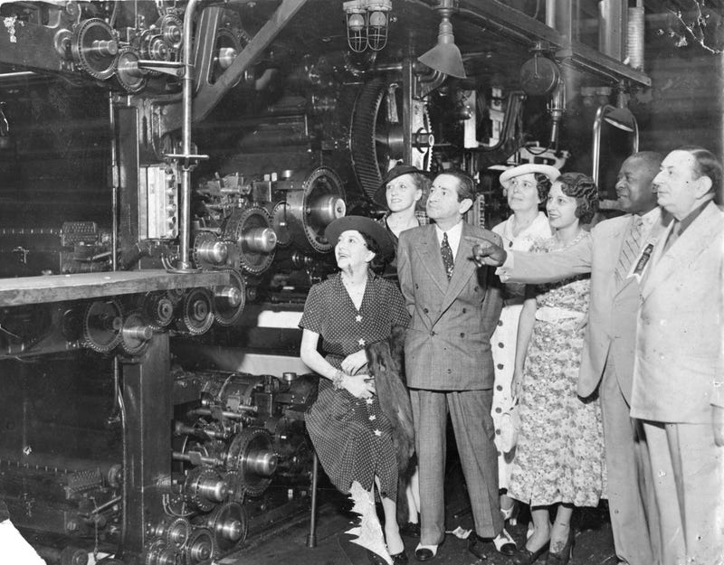 Vintage photo of Robert S. Abbott at printing press