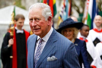 FILE - In this Monday, March 9, 2020 file photo, Prince Charles and Camilla the Duchess of Cornwall, in the background, leave after attending the annual Commonwealth Day service at Westminster Abbey in London. (AP Photo/Kirsty Wigglesworth, File)