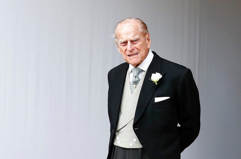 In this Friday, Oct. 12, 2018 file photo, Britain's Prince Philip waits for the bridal procession following the wedding of Princess Eugenie of York and Jack Brooksbank in St George's Chapel, Windsor Castle.