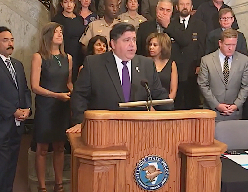 Gov. J.B. Pritzker speaks at a signing of an executive order to address Illinois’ DNA sample backlog.