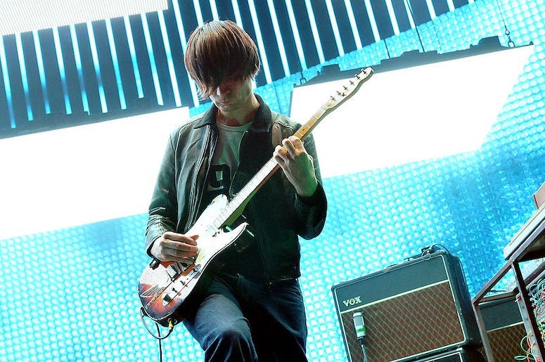 Jonny Greenwood of the band Radiohead plays guitar live in concert.