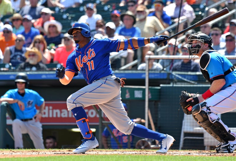 Mar 12, 2019; Jupiter, FL, USA; New York Mets second basemen Rajai Davis (11) hits a double against the Miami Marlins during a spring training game at Roger Dean Chevrolet Stadium. Mandatory Credit: Steve Mitchell-USA TODAY Sports