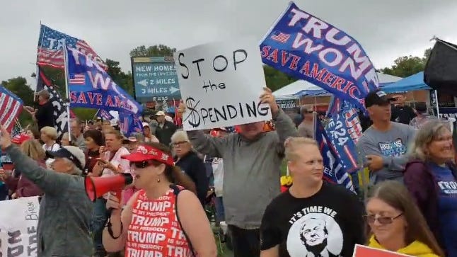 Thousands with 'Trump won' flags, MAGA hats rally against Biden during visit to Michigan