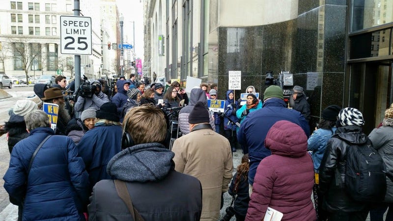 Several dozen demonstrators took to the street in front of U.S. Senator Pat Toomey’s office to urge him to vote to end the partial federal government shutdown.