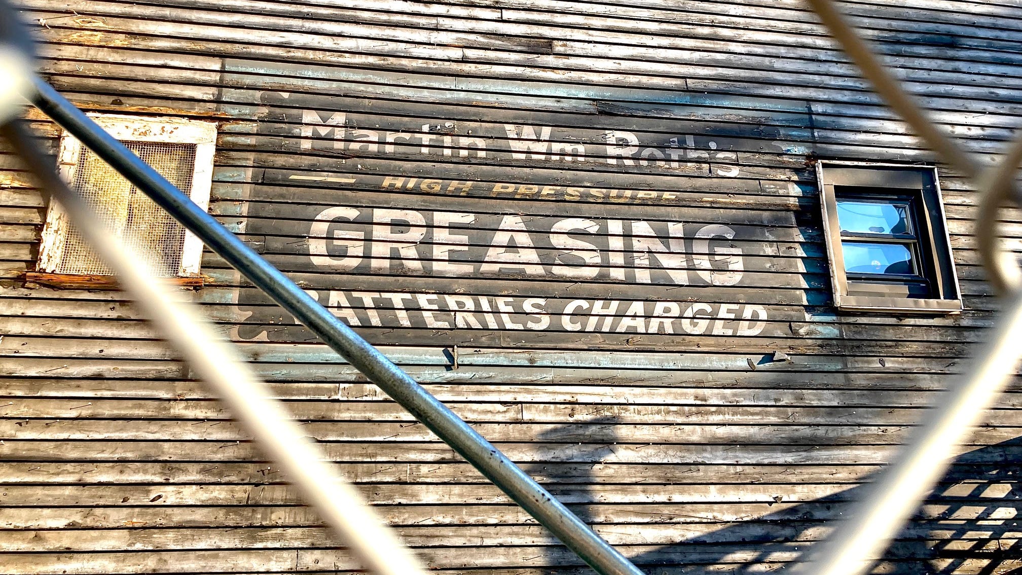 Demolition exposes 'ghost ads' on side of Ravenswood building from nearly 100 years ago