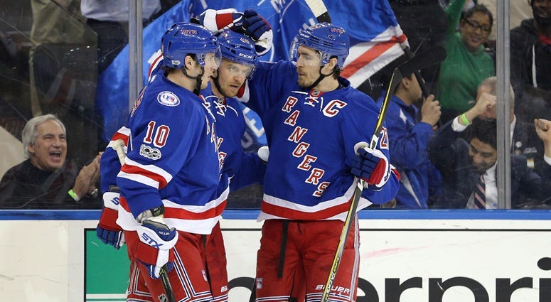 Rangers right wing Michael Grabner (40) celebrates his goal against the Tampa Bay Lightning with center J.T. Miller (10) and defenseman Ryan McDonagh (27) on March 13, 2017, at Madison Square Garden.