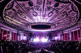 The owner of the Rapids Theater and an associate are charged with defrauding the PPP and Economic Injury Disaster Loan programs.