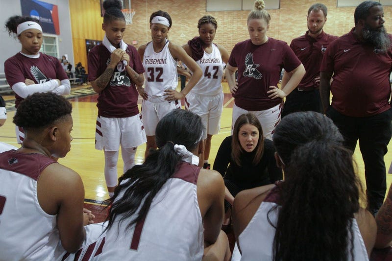 Rosemont head women's basketball coach Rayne Reber talks to her team during a timeout.