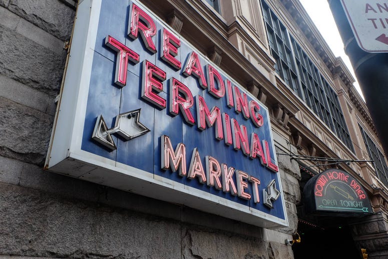 An exterior sign for Reading Terminal Market.