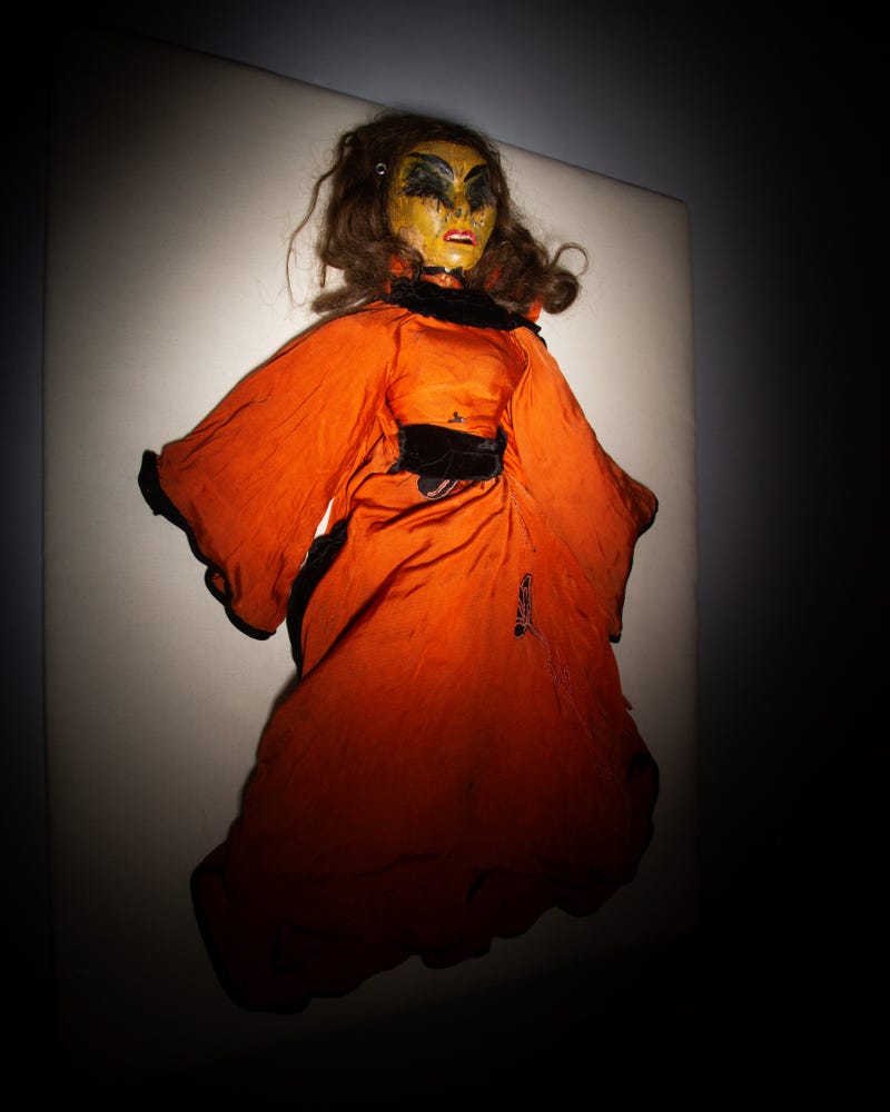 doll in orange dress