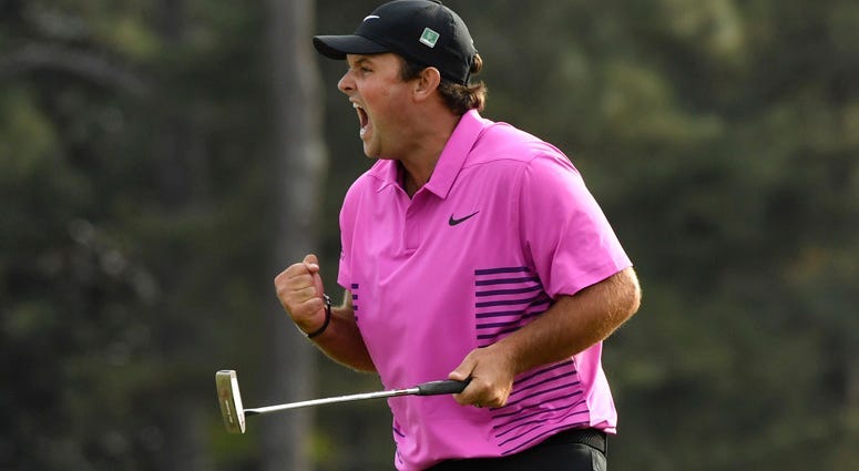 Patrick Reed celebrates after making a putt on the 18th green to win the Masters on April 8, 2018, at Augusta National Golf Club.
