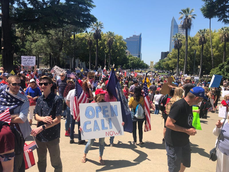Protestors call for Governor Gavin Newsom to reopen California at a rally at the state capitol, May 1, 2020
