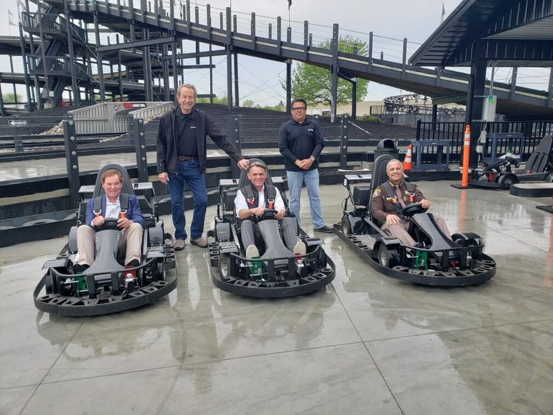 Three men in Go Karts