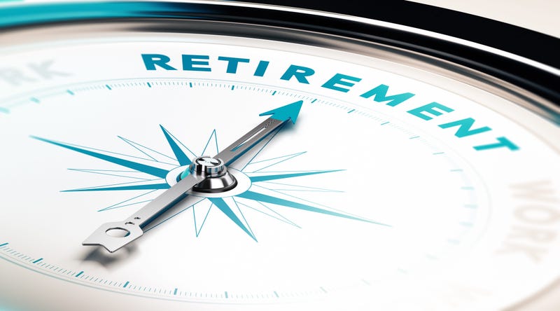 Compass with needle pointing the word retirement