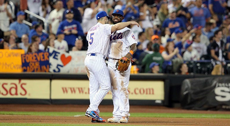 Sep 29, 2018; New York Mets third baseman David Wright (5) hugs New York Mets shortstop Jose Reyes (7) after being shown on the \"kiss cam\" during the fifth inning against the Miami Marlins at Citi Field. Brad Penner-USA TODAY Sports