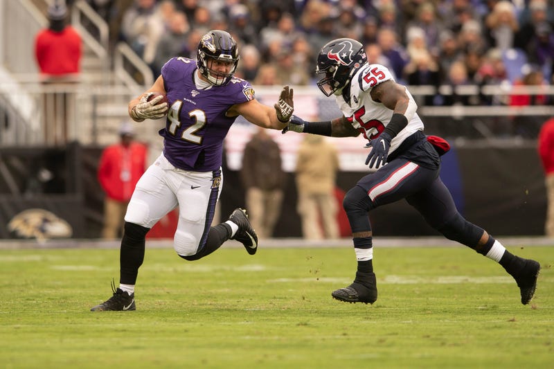 Patrick Ricard avoids a tackle in the Ravens win over Houston. 
