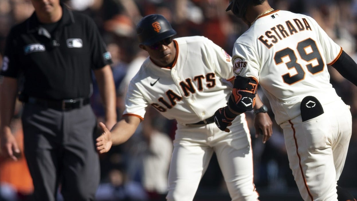 Giants coach Antoan Richardson embraces Mike Shildt after claiming his comments had 'racist undertones'