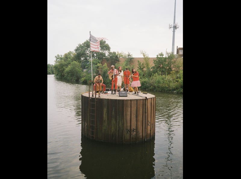 Lawrence Tome band performing on Chicago River