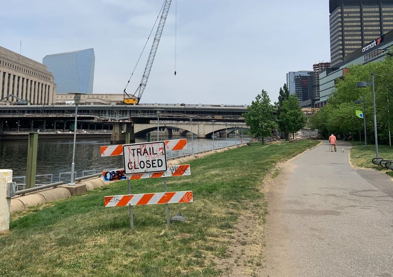A section of the Schuylkill River Trail has a "trail closed" sign.