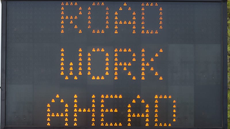 Road Work Ahead sign at a construction project - stock photo
