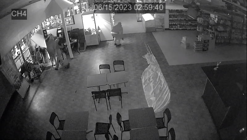 security video of several men breaking into an empty store