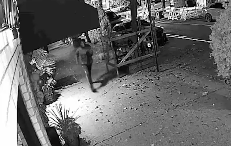Video appears to show the suspect dropping the backpack on a sidewalk after fleeing the 104th Street station in Ozone Park
