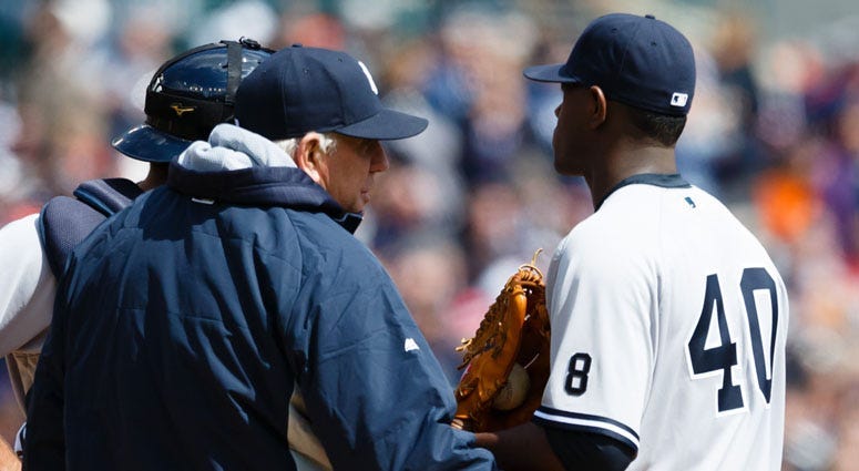 FILE -- Yankees pitching coach Larry Rothschild talks to starting pitcher Luis Severino during a game.