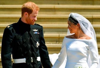FILE - In this Saturday, May 19, 2018 file photo, Britain's Prince Harry and Meghan Markle walk down the steps after their wedding at St. George's Chapel in Windsor Castle in Windsor, England. (Ben Birchhall/pool photo via AP, file)