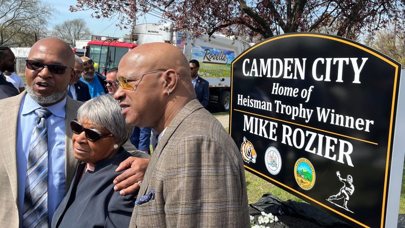 Former NFL running back Mike Rozier (right), with his mother Beatrice and brother Guy