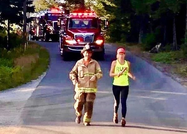Steve Bender and Lisa Steiner running the first stage of the Run 2 Respond Relay with an escort from Great Cranberry Island Fire Department in Maine.