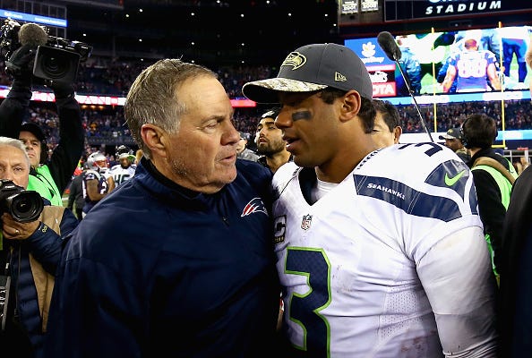 Russell Wilson greets Bill Belichick after a game.