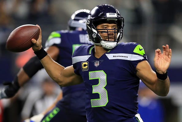 Russell Wilson looks for a receiver against the Cowboys