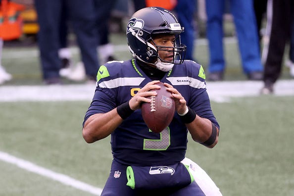 Russell Wilson drops back for a pass with the Seahawks.