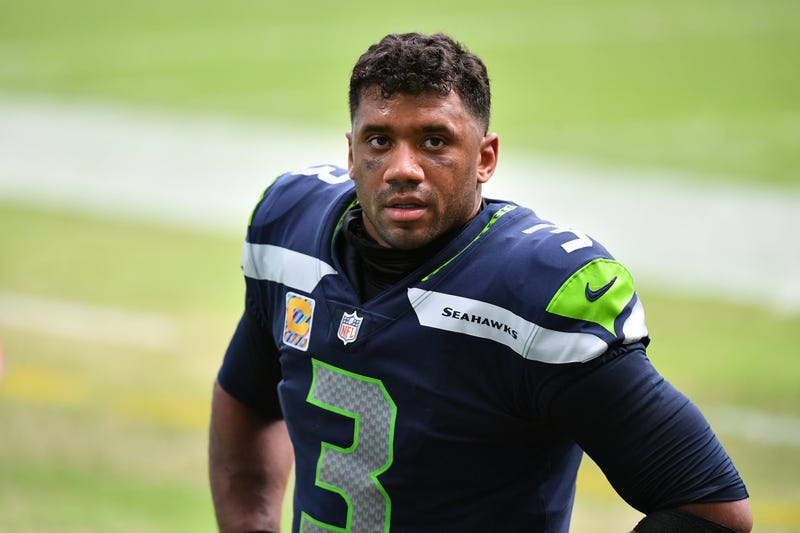 Russell Wilson looks on from the Seahawks sideline. 