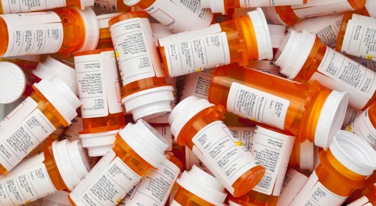 pile of prescription drug bottles