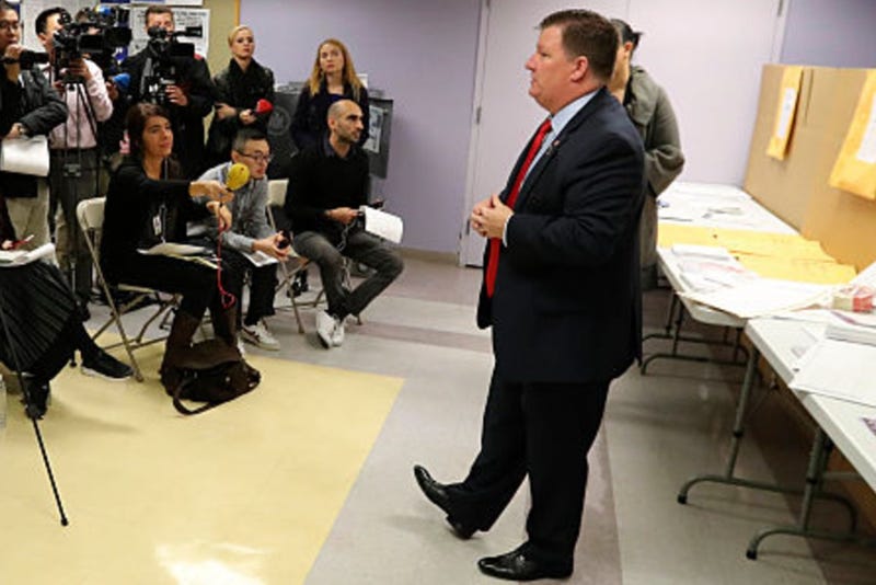 Michael Ryan, executive director of the New York City Board of Elections, introduces the ballot-casting process for journalists during a pre-election voting demonstration on Nov. 7, 2016.