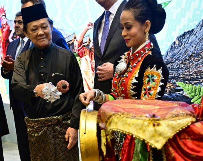 Malaysia's Minister for Tourism, Art and Culture Mohamaddin Ketapi attends a welcome ceremony at a booth promoting his country during the International Tourism Trade Fair (ITB) in Berlin.