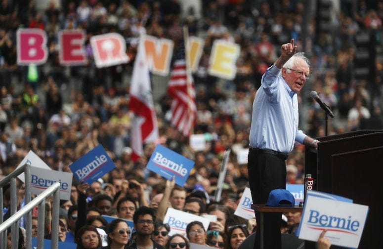 2020 Democratic presidential candidate U.S. Sen. Bernie Sanders (I-VT), R, speaks at a campaign rally in Grand Park on March 23, 2019 in Los Angeles, California.