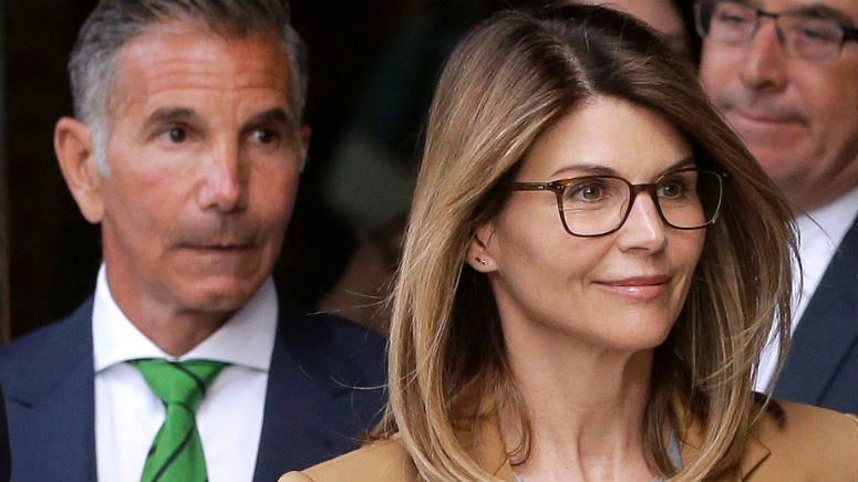 17 parents charged in connection with the college admission scandal -- including actress Lori Loughlin and her husband Mossimo Giannulli -- are asking the court to suspend "substantive motion practice" until they can review the prosecutors' evidence.
